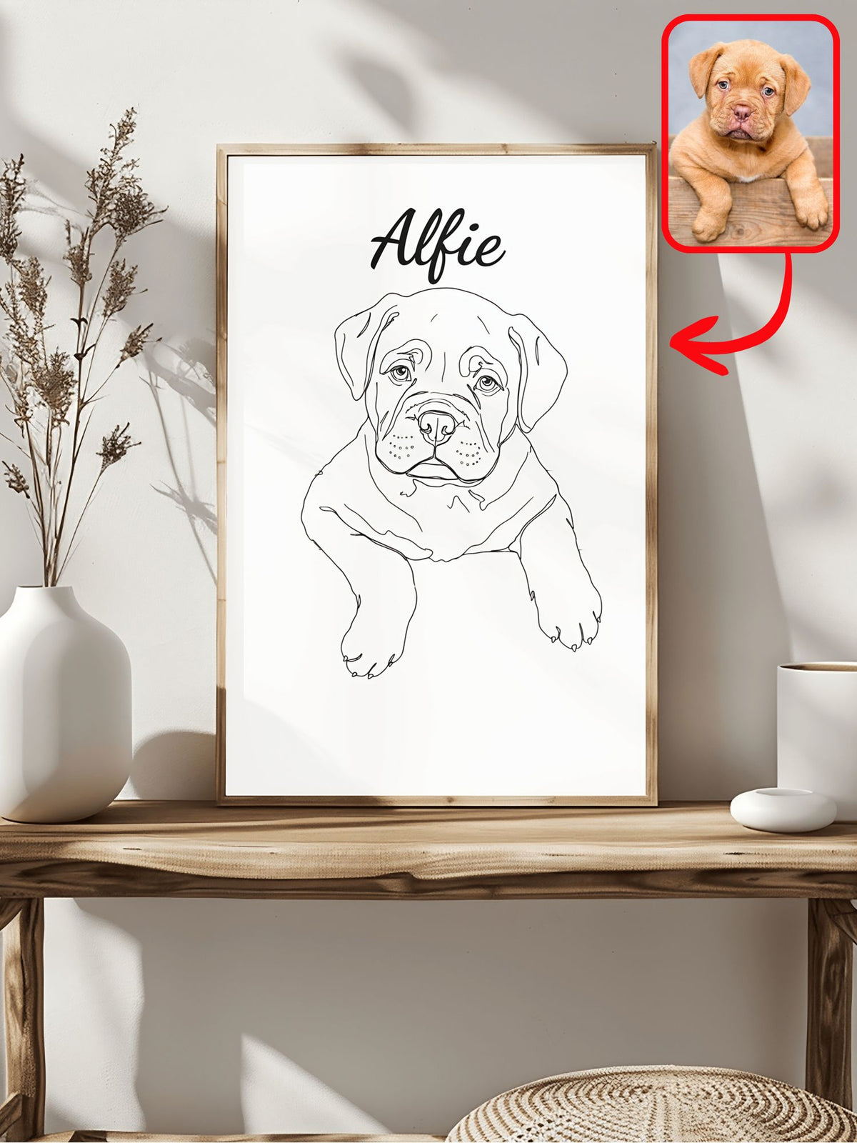 Minimalist line art dog portrait of a puppy named Alfie in a wood frame, next to the original photo