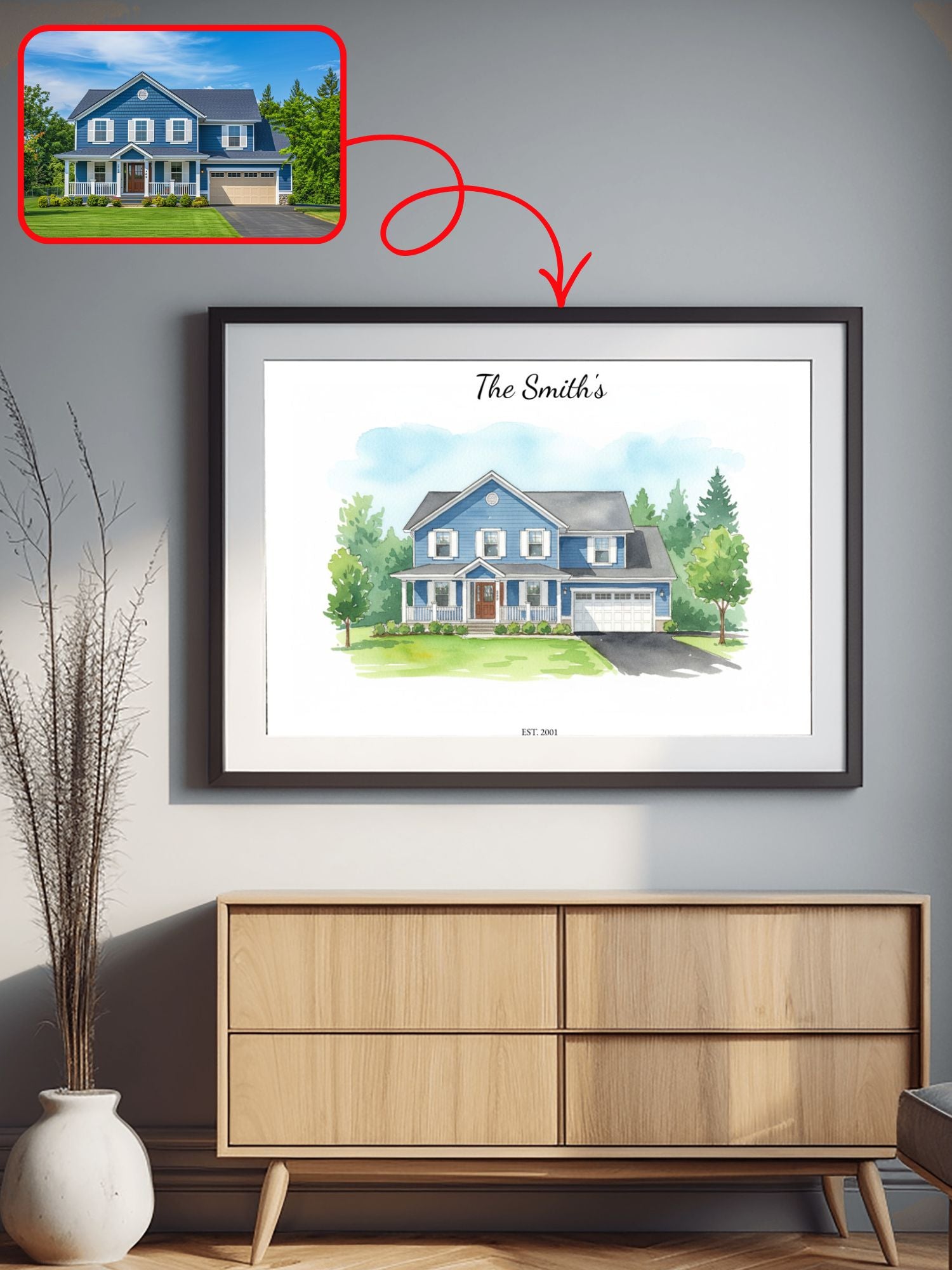 Framed illustration of a house with 'The Smiths' text on a wall above a wooden cabinet.